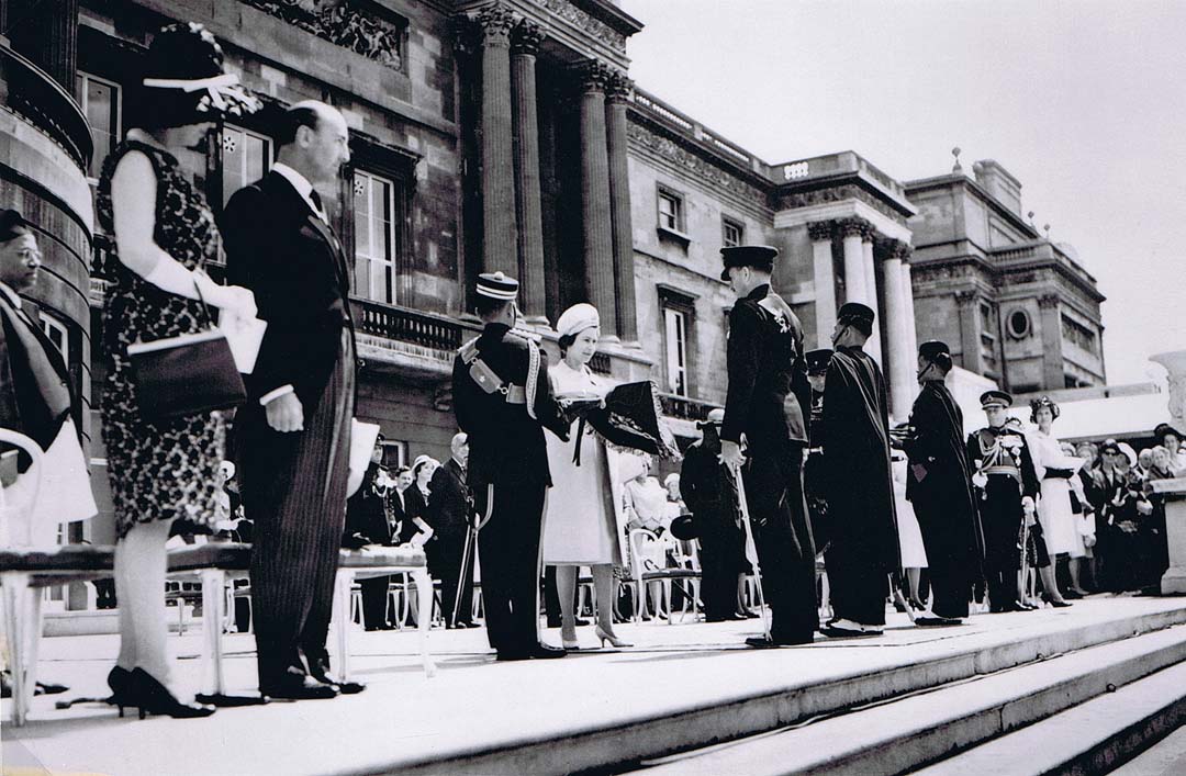 Her Majesty presenting the Royal Pipe Banners for both Battalions at Buckingham Palace 27 June 1962. Field Marshal Lord Harding can be seen on the right beyond the second Pipe Major.